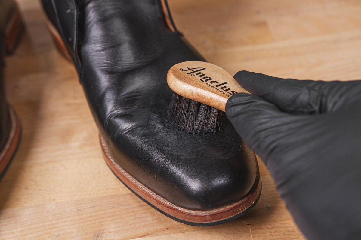 Buffing a black leather dress shoe with the Angelus horsehair brush