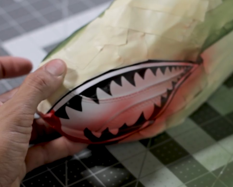 Airbrushed shark mouth design painted on a sneaker sole for a display piece