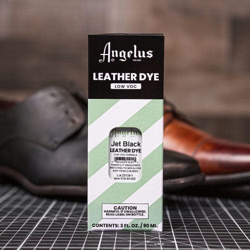 Angelus Jet Black Leather Dye beside a pair of leather dress shoes