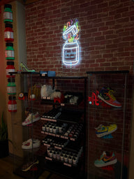 Angelus Bottle Changing Neon Sign in Store
