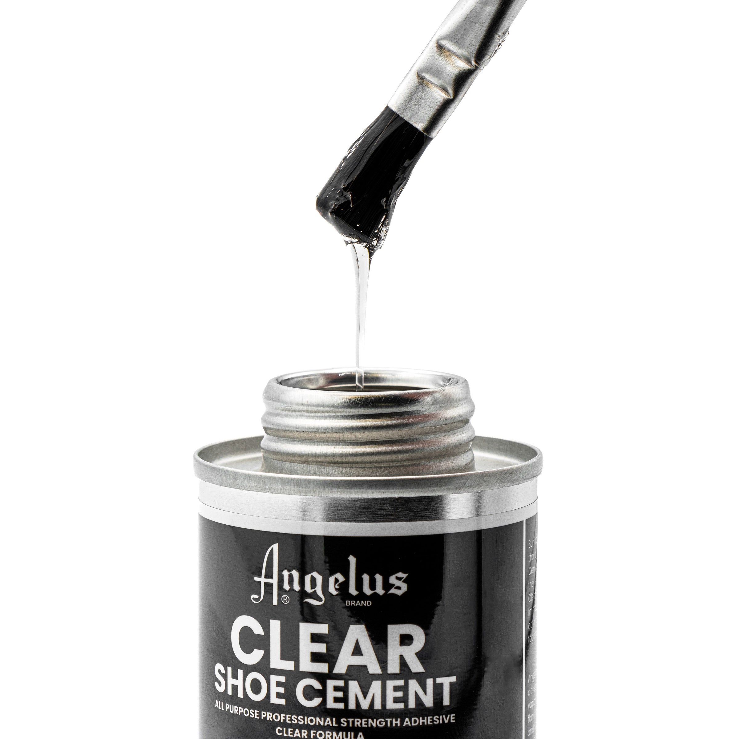 A brush coated with Angelus Direct’s Angelus Clear Shoe Cement is lifted from an open tin. The thick, stringy adhesive is ideal for re-gluing shoe soles or as an all-purpose glue.