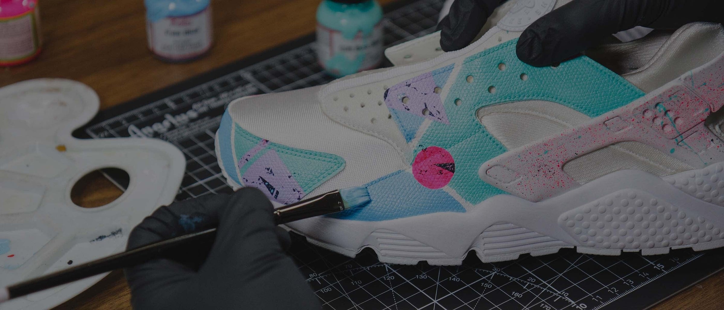 Hand painting a custom design on a white leather sneaker using Angelus leather paint